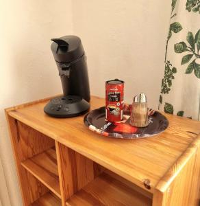 a coffee maker on top of a wooden table at Holiday Apartment 2 Villach in Villach