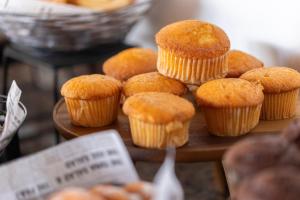 a bunch of muffins sitting on a wooden table at HM Alma de Bayahibe - Adults Only in Bayahibe