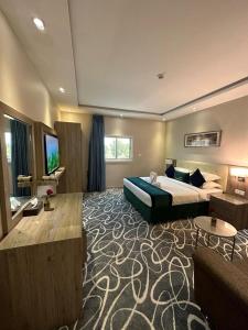 Postel nebo postele na pokoji v ubytování Sunrise Suites