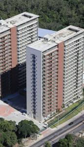 an aerial view of two tall buildings next to a highway at Via premiere in Rio de Janeiro