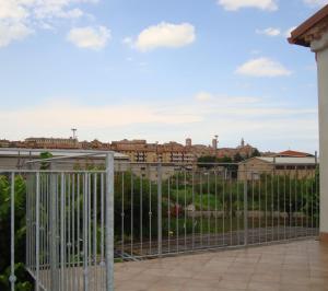 a fence with a view of a city at B&B Verziere in Iesi