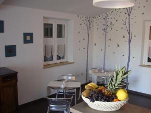 a bowl of fruit on a table in a room at B&B Verziere in Iesi