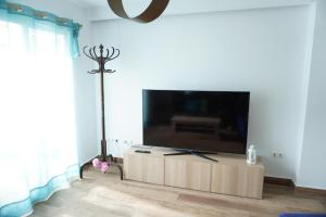 a living room with a large flat screen tv at Apartamento Avenida Principal II in Altea