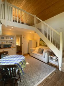 a bedroom with a bunk bed and a staircase at Little Barn in Dorchester