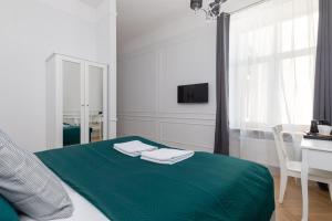 Posteľ alebo postele v izbe v ubytovaní Lwowska 9 - Cozy & Comfortable Studio by Noclegi Renters