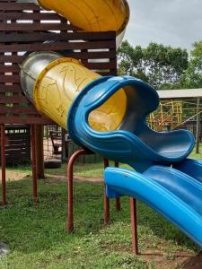 a blue and yellow slide at a playground at Sabie River Camp in Sabie