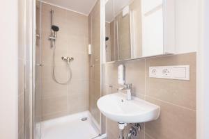 Ein Badezimmer in der Unterkunft Homaris Apartments München Laim