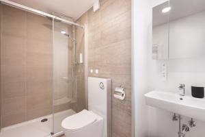 Ein Badezimmer in der Unterkunft Homaris Apartments München Laim