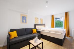 Ein Bett oder Betten in einem Zimmer der Unterkunft Homaris Apartments München Laim