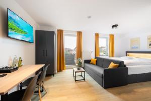 Ein Bett oder Betten in einem Zimmer der Unterkunft Homaris Apartments München Laim