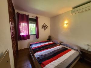 Postel nebo postele na pokoji v ubytování Nueva Playa