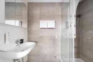 Ein Badezimmer in der Unterkunft Homaris Apartments München Laim