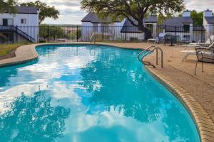 a swimming pool with blue water in a yard at 1185 Parkview Dr Unit 22 in Canyon Lake
