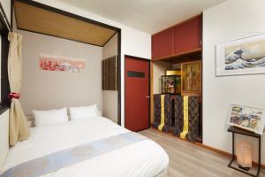 Postelja oz. postelje v sobi nastanitve Villa Hakone Kabuto 古民家旅館 150平米 バス停迄一分 準天然温泉 最大12名