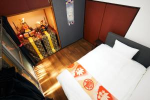 Postelja oz. postelje v sobi nastanitve Villa Hakone Kabuto 古民家旅館 150平米 バス停迄一分 準天然温泉 最大12名