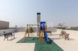a playground on the roof of a building at Comfortable Apartment Close To Shopping Mariscal in Asunción