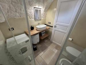 a bathroom with a toilet and a sink and a shower at RocknTrullo 2 bedroom by TripOstuni in Ostuni