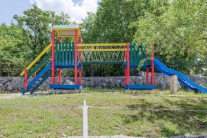 a group of playground equipment in a park at Villa Smajo in Kotlenice