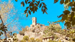 a clock tower on top of a mountain at Charming Apartment in Tolva, 50 m², with Terrace in Tolva