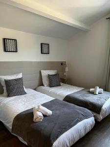 Кровать или кровати в номере Hotel Cote et Lac