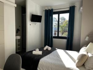 Кровать или кровати в номере Hotel Cote et Lac