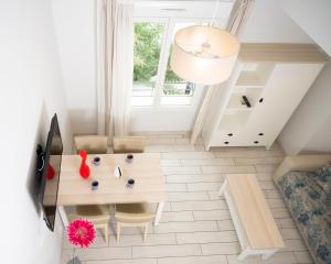 a small dining room with a table and chairs at Hotel La Ciotat - A deux pas de l'eau in La Ciotat