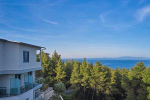 a view of the ocean from a building at Mirabilia Boutique Hotel in Kriopigi