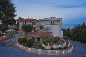 an aerial view of a large house with lights at Mirabilia Boutique Hotel in Kriopigi