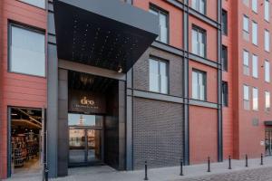a building with a colo store on a street at Deo Plaza Premium by Rent like home in Gdańsk