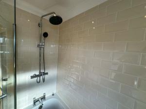 a bathroom with a shower and a sink at One Bedroom Flat - Free Parking in Silverstone