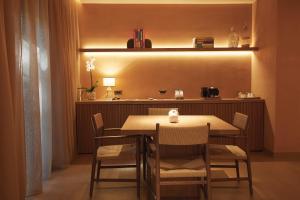 a dining room with a table and chairs at The Margi in Athens