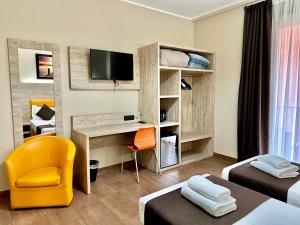 Postel nebo postele na pokoji v ubytování Hotel Giacosa