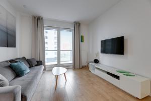 Televízia a/alebo spoločenská miestnosť v ubytovaní Apartament Nadmorskie Spektrum & Parking