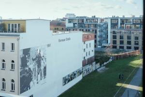 a mural on the side of a building at NOMADS by Suite030 high class apartments, 1-2 bedrooms in Berlin