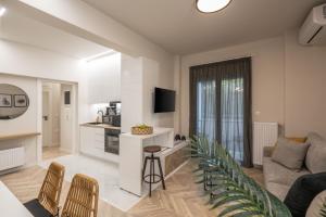 a living room with a couch and a table at Charming two bedrooms Apartment walk to Acropolis in Athens