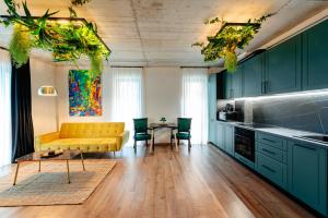 a living room with a yellow couch and a table at Centro Accommodation in Cluj-Napoca