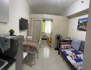 a room with a kitchen and a living room at Sea Residences MOA Manila - Jo Alano in Manila