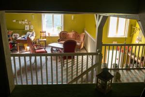 a living room with a couch and chairs and a table at Auberge de la Cholotte in Les Rouges-Eaux