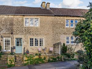 a brick house with two chairs in front of it at 1 bed property in Bradford-On-Avon 82251 in Bradford on Avon
