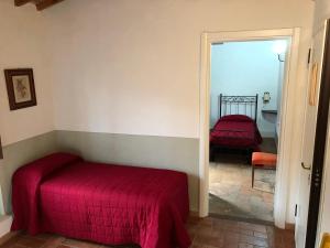 A bed or beds in a room at Poggio Savelli