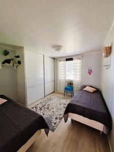 Tempat tidur dalam kamar di Taivalviiri
