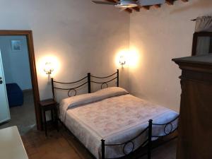 A bed or beds in a room at Poggio Savelli