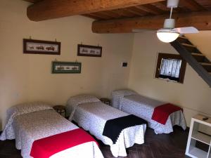 A bed or beds in a room at Poggio Savelli