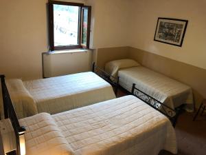 A bed or beds in a room at Poggio Savelli