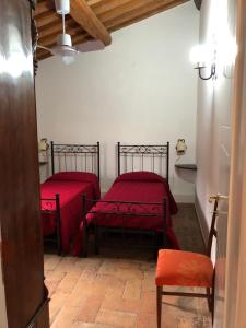 A bed or beds in a room at Poggio Savelli