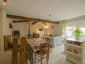 a kitchen and dining room with a table and chairs at Chambres d hôtes chez Georges in Spoy