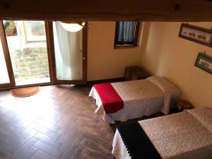 A bed or beds in a room at Poggio Savelli