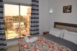 Postel nebo postele na pokoji v ubytování Hotel La Place