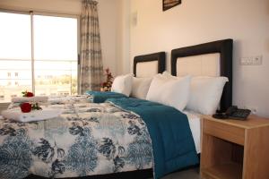 Postel nebo postele na pokoji v ubytování Hotel La Place
