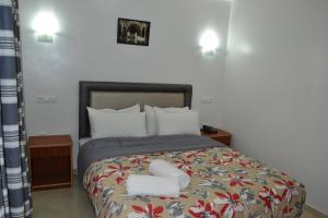 Postel nebo postele na pokoji v ubytování Hotel La Place